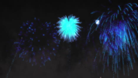 animation of blue fireworks exploding on black background