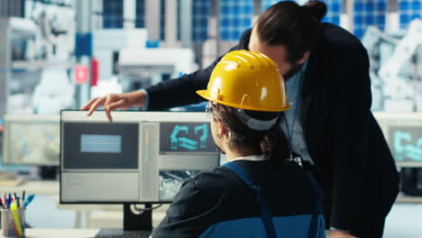 solar panel plant manager showing engineer how to develop prototypes