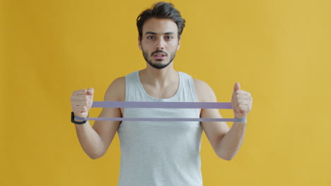 man using resistance band for workout