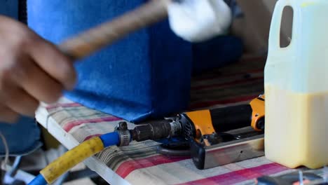 tools of an upholsterer, putting down the rubber hammer and taking a staple gun