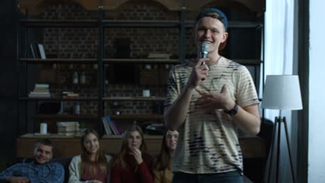 emotional guy performing song in home karaoke
