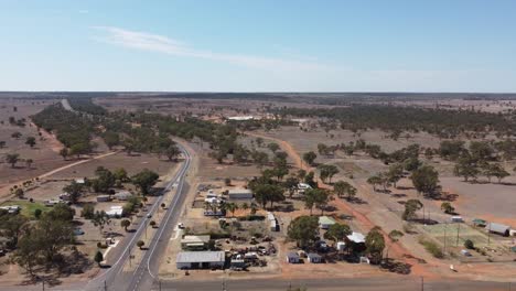 aerial view of a small town and a highway passing through with intersection