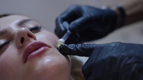 woman receiving a facial cosmetic treatment at a beauty salon