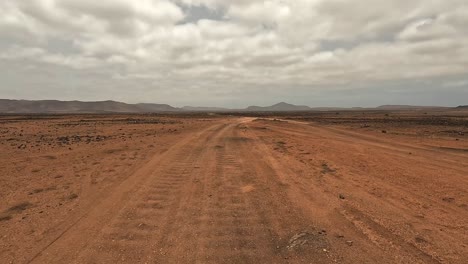 driving on volcanic desert dirt road of boa vista island, cape verde. car point of view