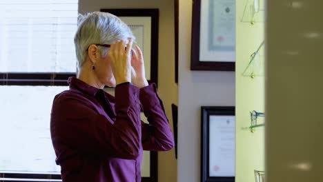 senior woman selecting frame 4k