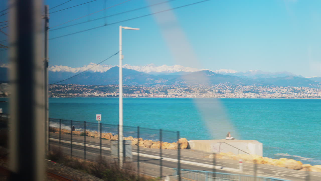 View from a moving train of the sea in Villeneuve-Loubet, France on a sunny day