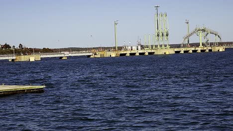 natural gas teminal in south portland, maine harbor with portland, maine in distance