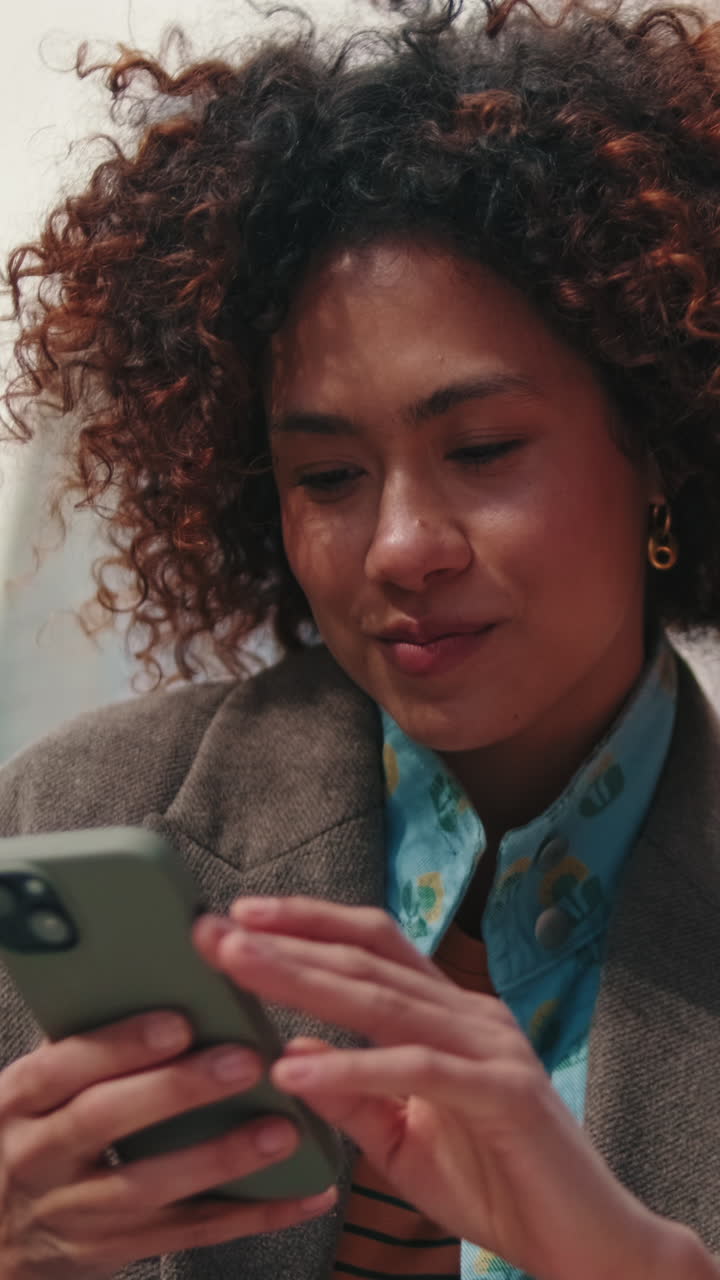 Young Businesswoman Using Smartphone in the City
