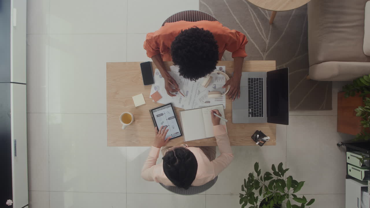 Businesspeople Meeting at Office to Discuss Work at Table Top View