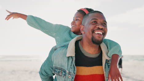 Father,-beach-and-pointing-with-girl