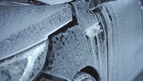 car being foamed for washing