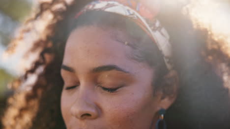 portrait of a woman with curly hair and headband