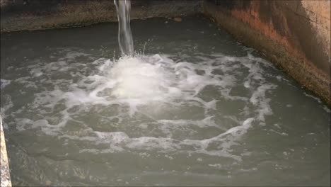 irrigation system in andalusia. elevated concrete irrigation canal dropping down a level in countryside in andalucía