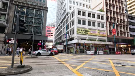 traffic and pedestrians at a bustling intersection