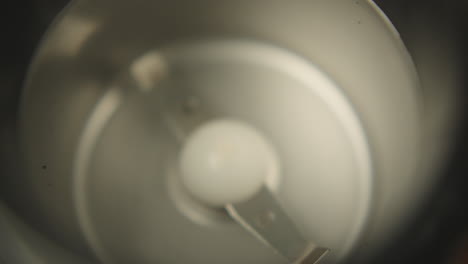 coffee beans falling into the  blender