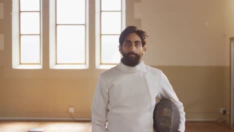 fencer athlete during a fencing training in a gym