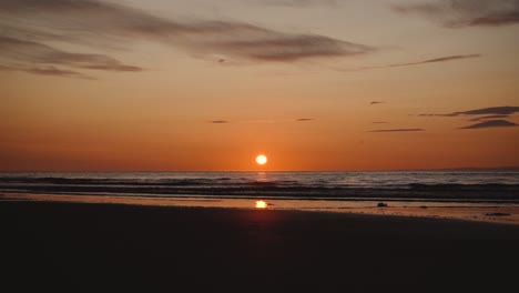 Man-running-with-guitar-in-back-sand-beach-at-sunset-24