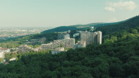 establishing drone shot of emmertsgrund neighborhood and white buildings during the day in heidelberg, state of baden-wurttemberg, germany