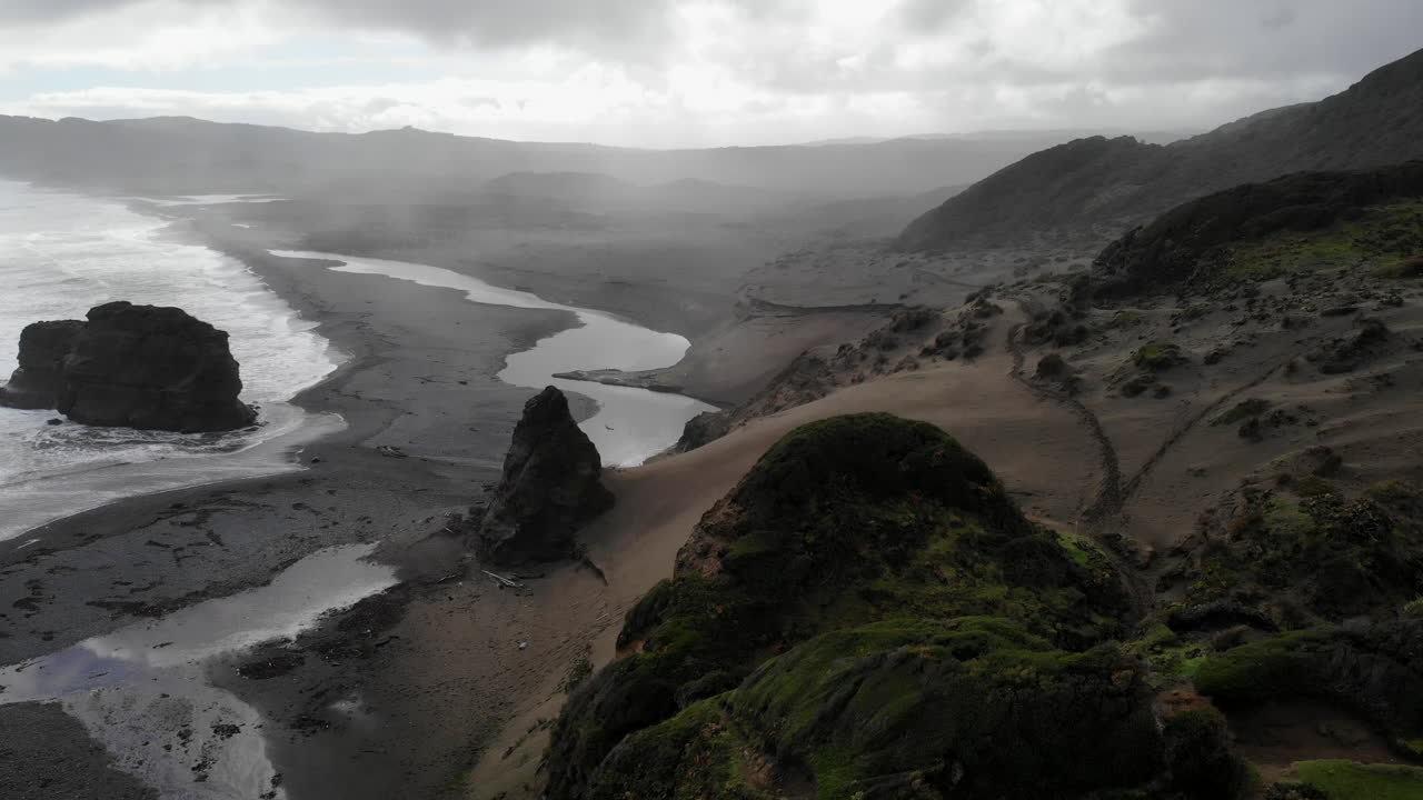 Coastal Landscape with Rock Formations and Sand Dunes