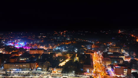 rising above the luminous panorama of snowy zakopane, poland. night view of winter ski resort from aerial perspective.