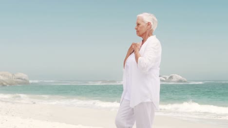 old retired woman doing some yoga
