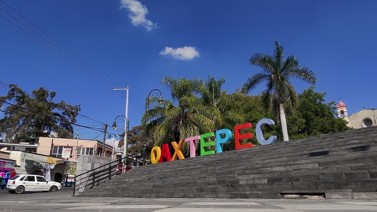 Wide push in shot of Oaxtepec city sign during the day in Morelos, Mexico