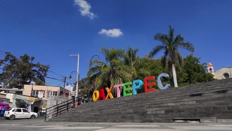 wide push in shot of oaxtepec city sign during the day in morelos, mexico