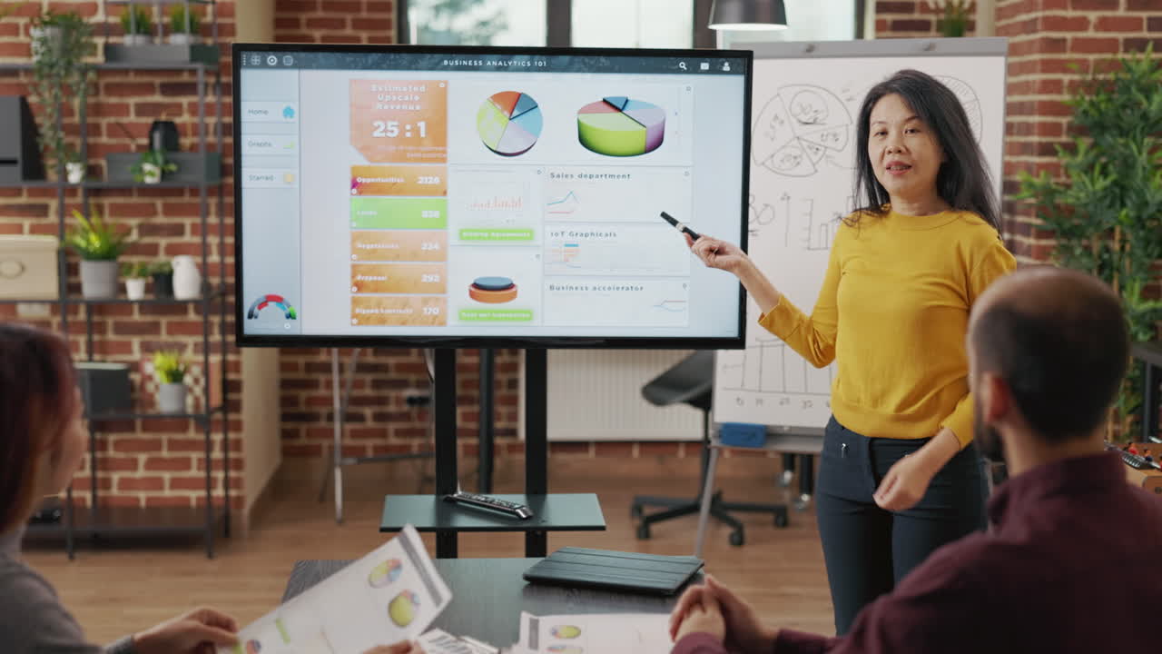 Coworkers attending briefing meeting together in boardroom