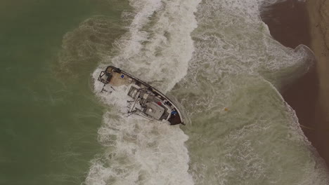 aerial shot over a shipwrecked fishing boat near ventura california 5