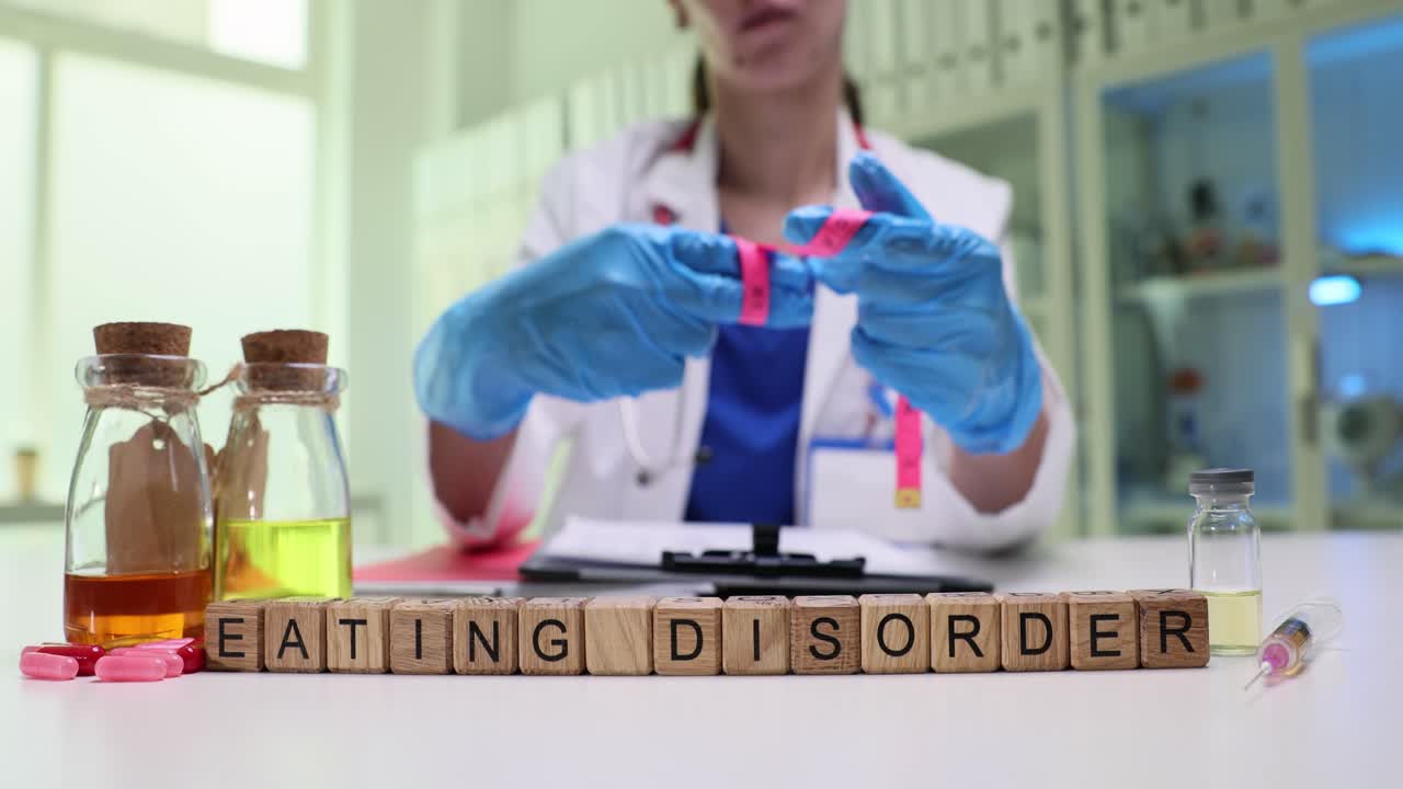 Miniature wooden cubes on table form phrase eating disorder