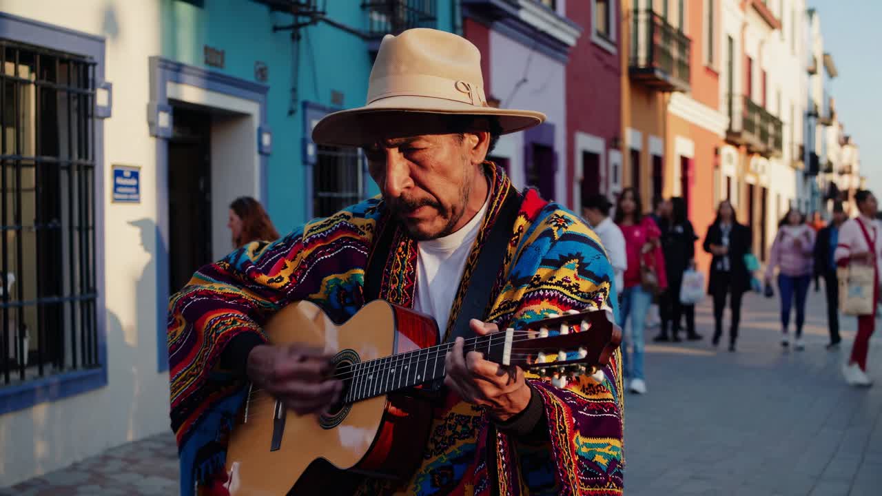 Street musician in colorful attire plays guitar, captured at eye level