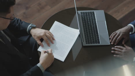 top down of business partners making deal