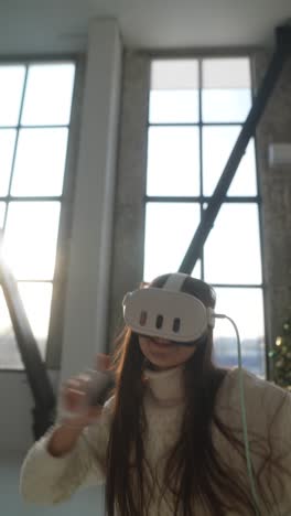 woman playing vr game at home during christmas