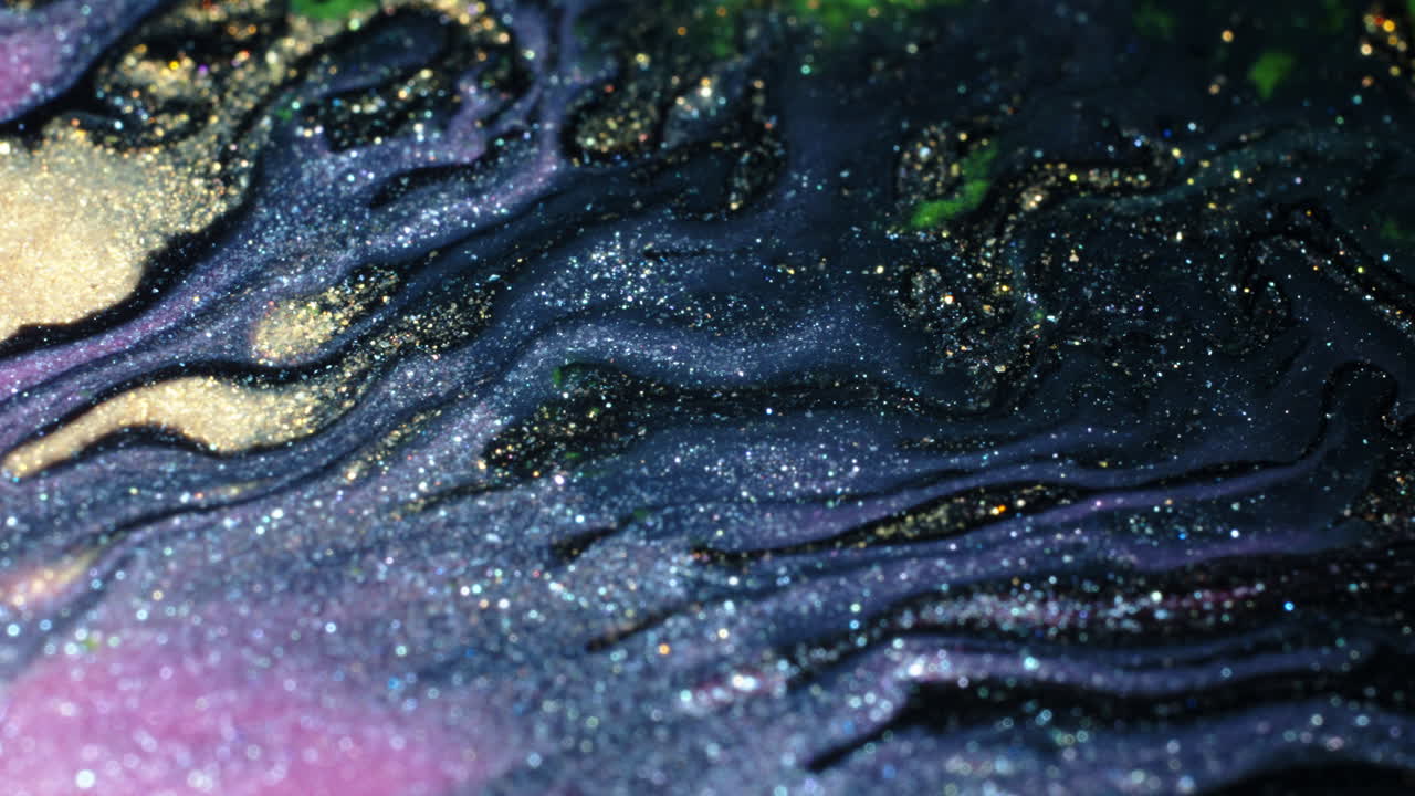 Macro shot of colorful substances mixing, creating fluid abstract patterns