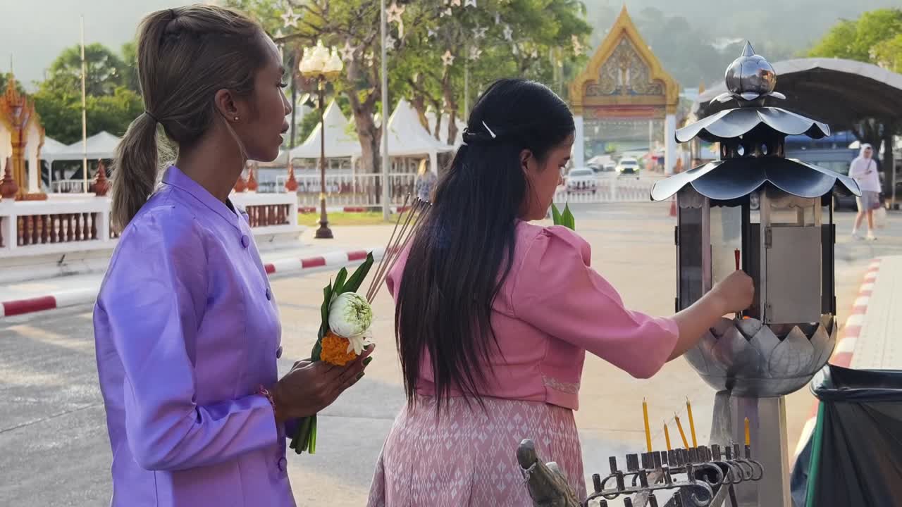 Women Praying at a Thai Temple