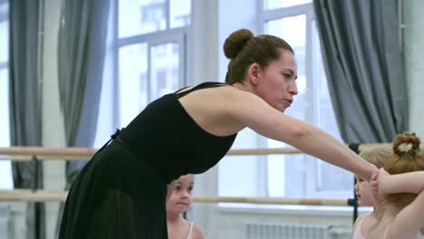 girls forming circle in ballet class