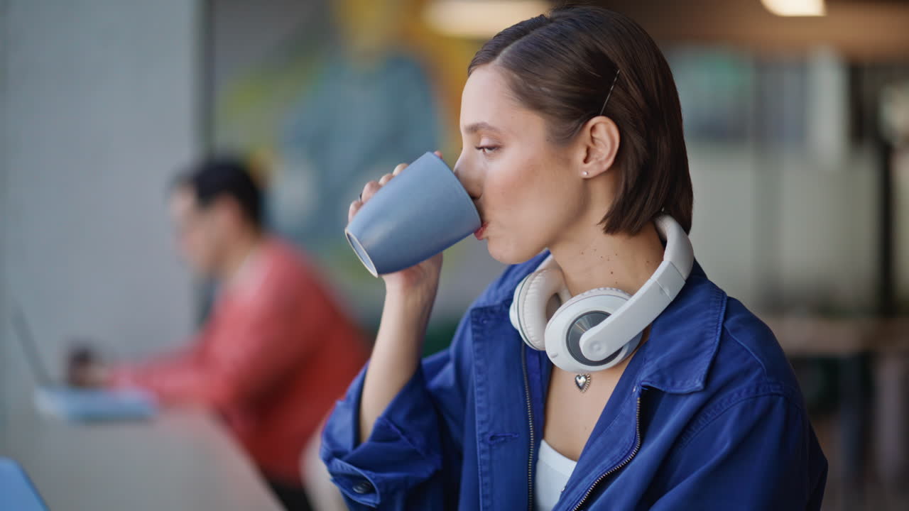 Pensive entrepreneur drinking coffee thinking on business at cafeteria closeup