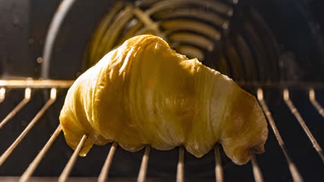 butter dripping from croissant bread baking in the oven