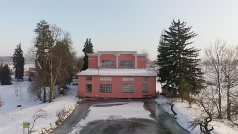 Drone-shot-of-small-hydro-power-plant-Haj-on-Czech-Morava-river-in-winter