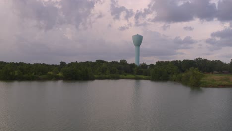 drone view of light blue water tower overlooking brays bayou in houston, tx