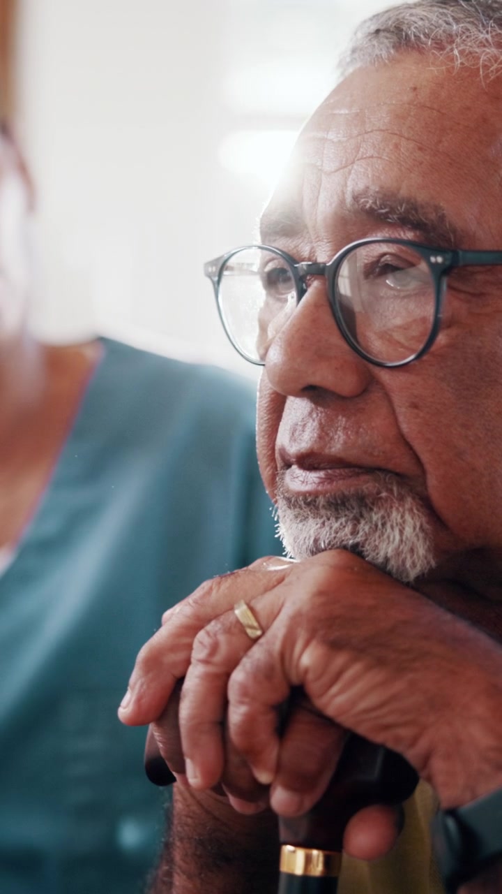Senior Man Listening to Caregiver During Consultation