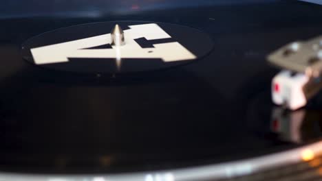 close up, modern turntable with rotating vinyl record, dj gear, equipment, a-side played