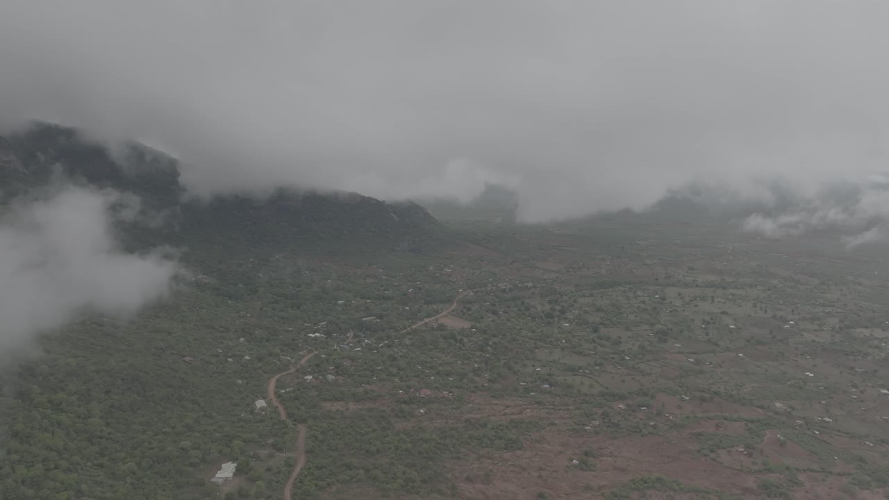 High altitude drone shot from a cloudy mountain