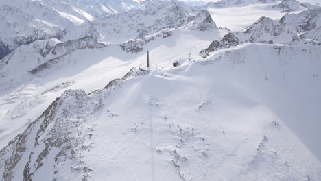 revealing drone shot of viewing platform with wooden pillar, on top of empty mountain,  in solden austria. 4k