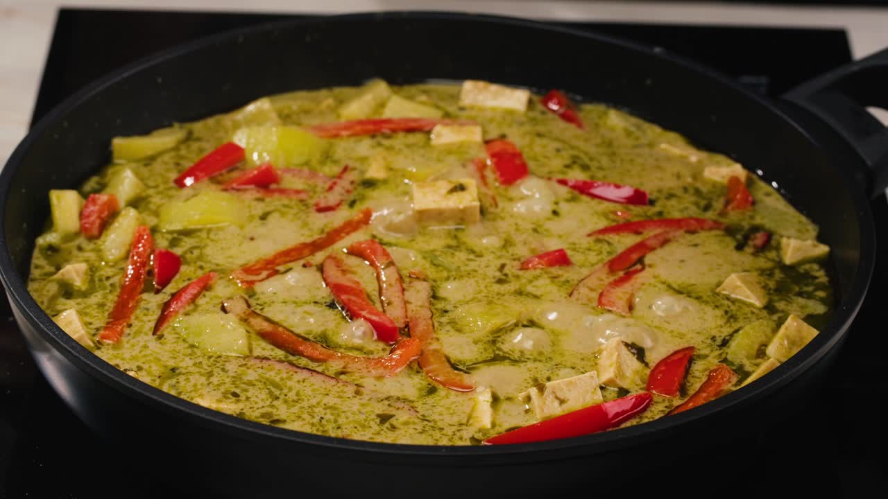 Making Green Curry with Tofu and Red Bell Peppers