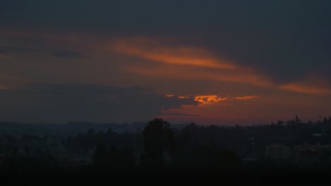 golden sunset in addis ababa, with thick clouds and the rays through them.