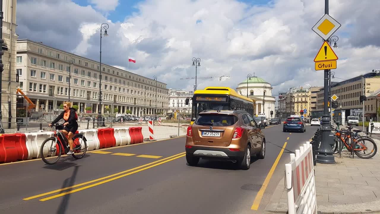 City Street Scene with Traffic and Cyclists