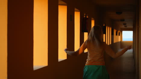 Dancing-in-hotel-corridor