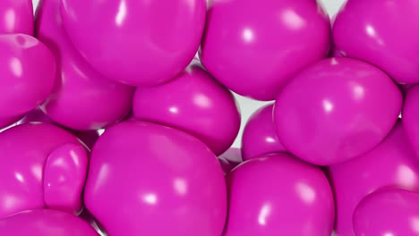 abstract colorful pink squishy balls move and interact with each other with internal pressure trying to find a place for themselves.