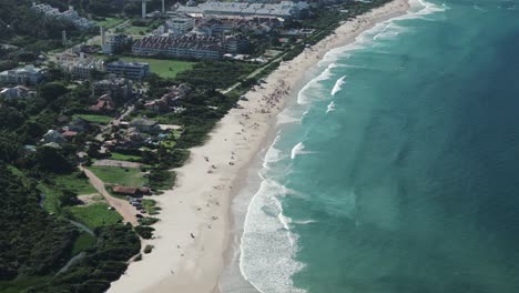 aerial image reveals the magnificent beauty of praia brava in florianopolis, showcasing its pristine shoreline and captivating coastal landscape